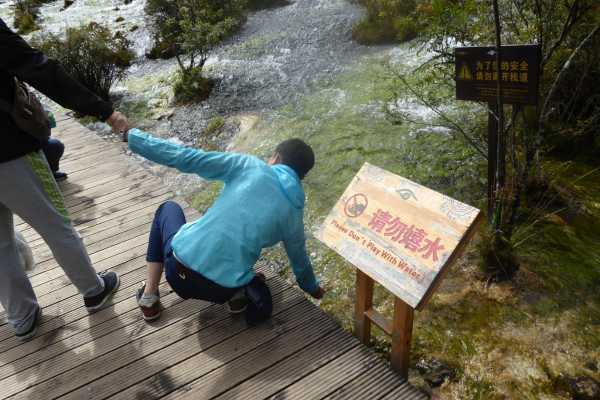 Tourists playing with Water Jiuzhaigou National Park