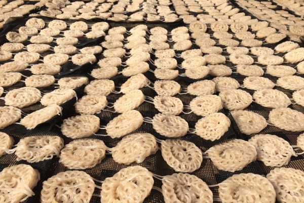 Krupuk drying on bamboo trays