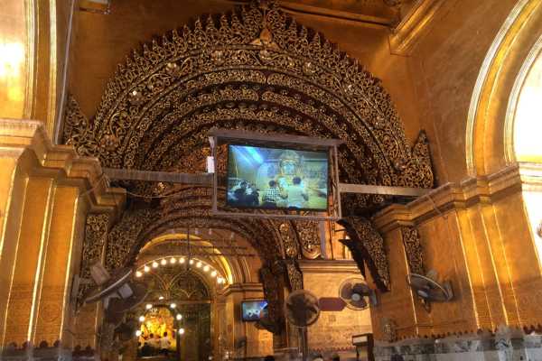 Viewing the buddha on TV at Mahamuni Pagoda