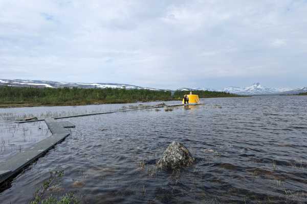 The Three Country Cairn in the Lake