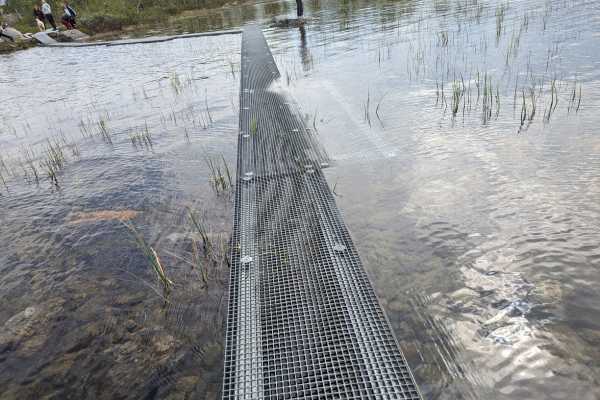 Walking back to Shore at the 3 Country Cairn