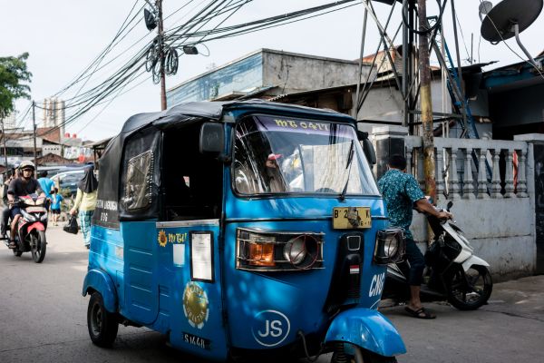 Rickshaw and motorbikes in Indonesia