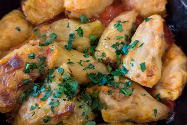 Traditional Moldovan sarmale cabbage rolls served in tomato sauce