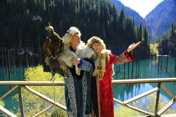 Kitschy Eagle Hunting Family Photo at Kaindy Lake