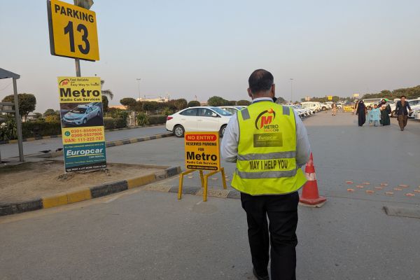 Metro Taxis Staff walking to taxi