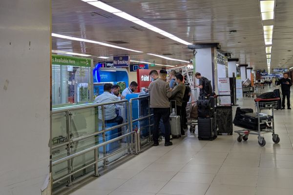 Local SIM card counters at the Arrivals hall, Dhaka airport
