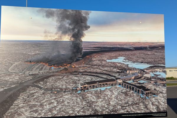 Photo display in Grindavik showing the recent eruption and Blue Lagoon car park